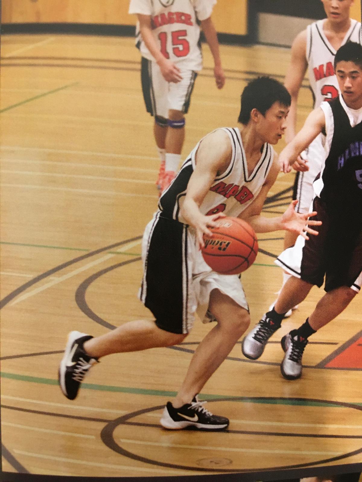 Aron playing basketball at Magee